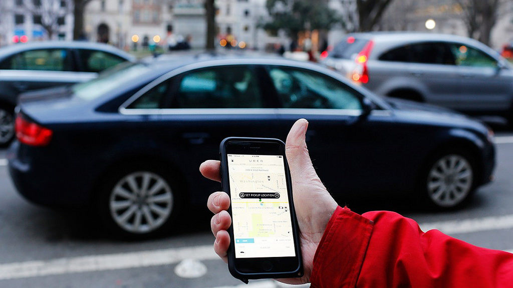 A customer calling an Uber cab by mobile
