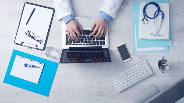 A doctor at their desk