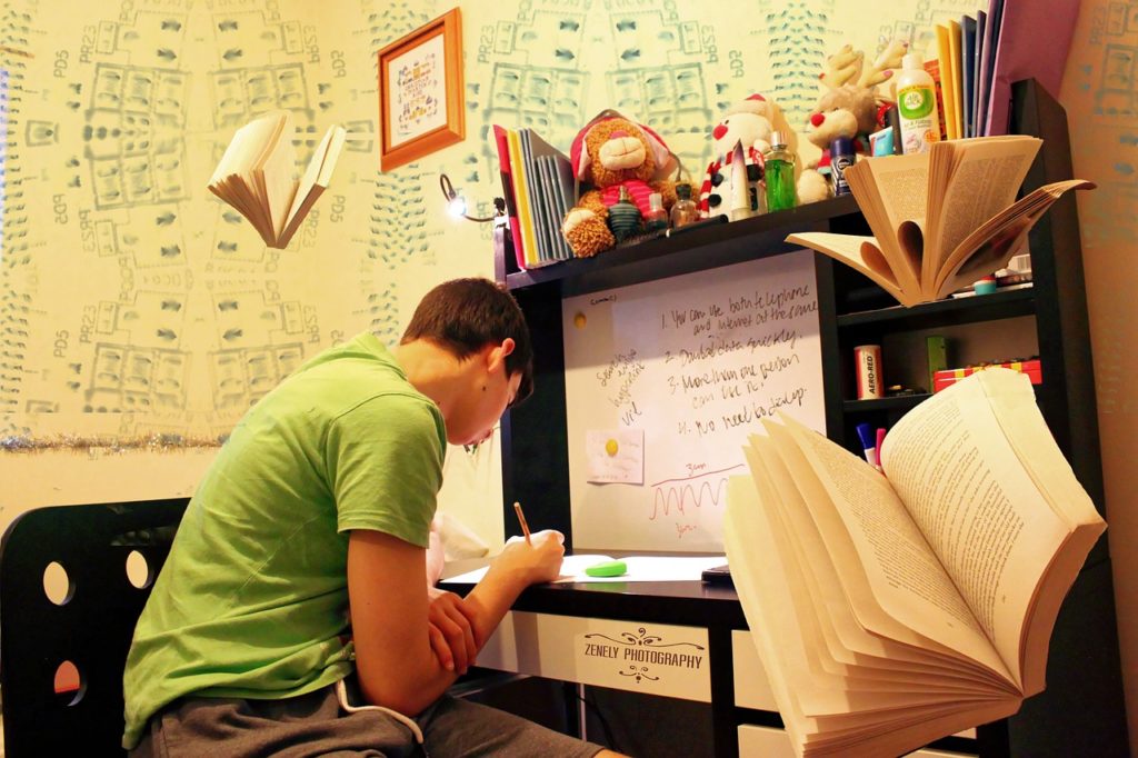 A teenager studying