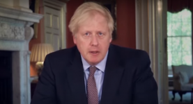 Boris Johnson speaking at a desk