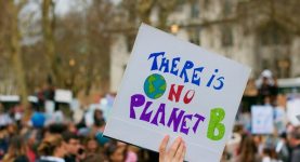 A placard with text reading "There is no planet B"