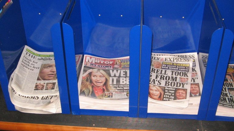 Newspapers in holder