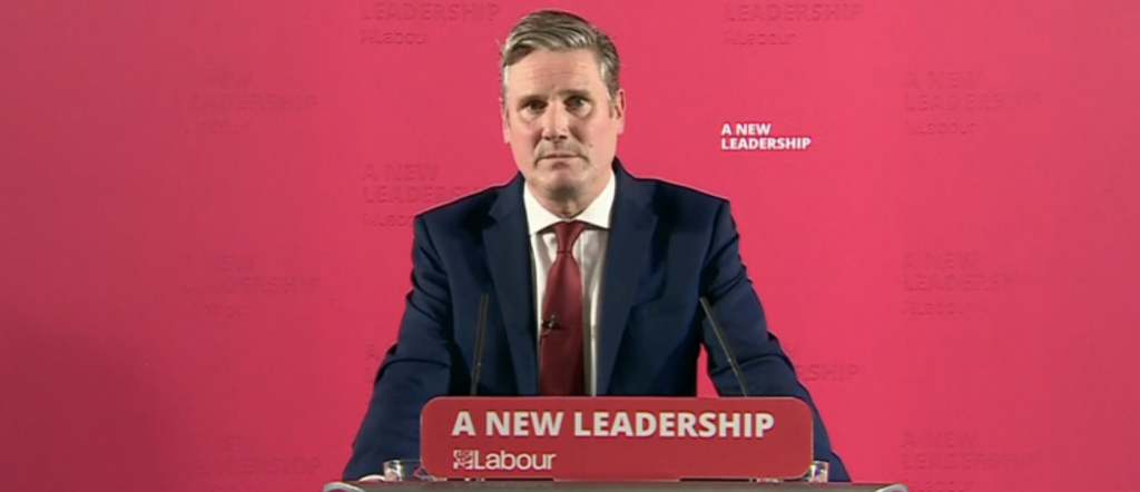 Keir Starmer speaking at a lectern