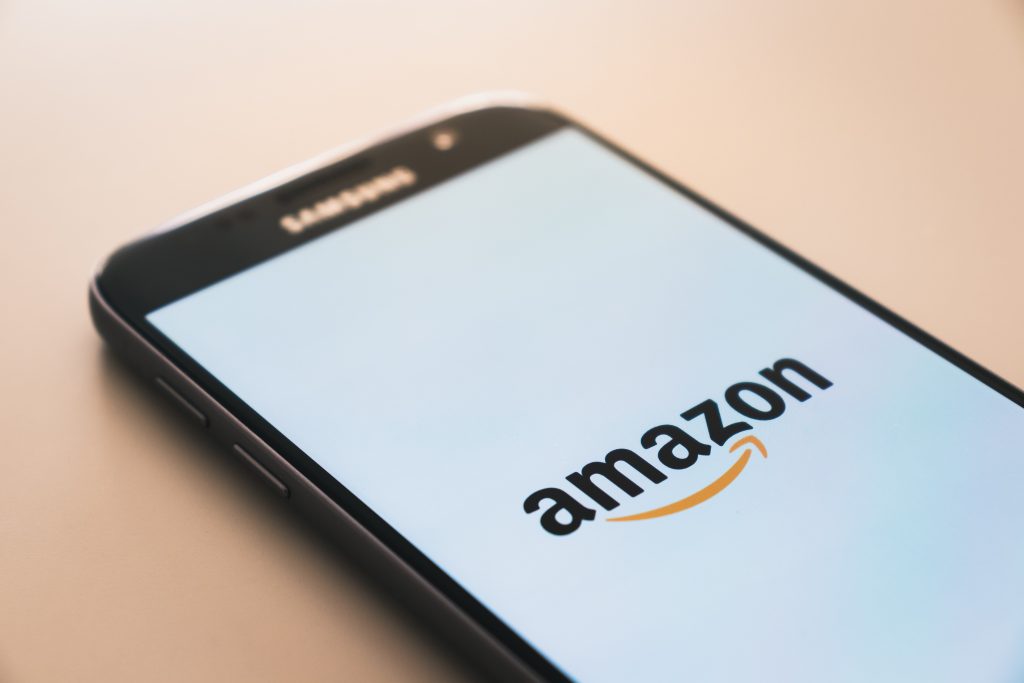 A phone with the Amazon logo on screen
