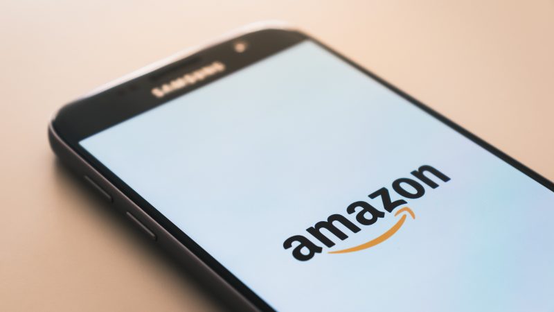 A phone with the Amazon logo on screen