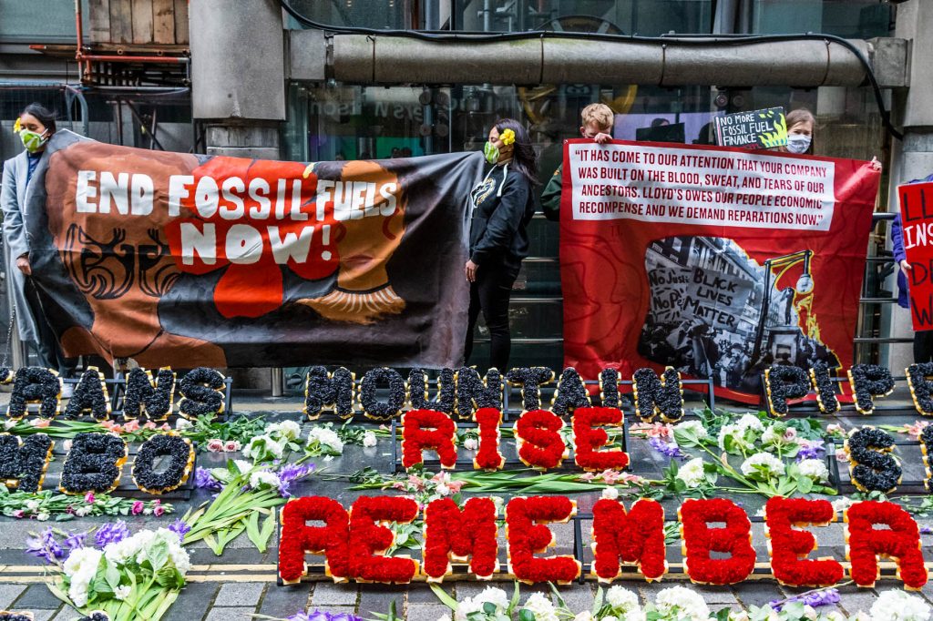 Protesters from Coal Action Network set up a climate justice memorial at Lloyd’s of London.