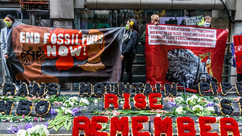 Protesters from Coal Action Network set up a climate justice memorial at Lloyd’s of London.