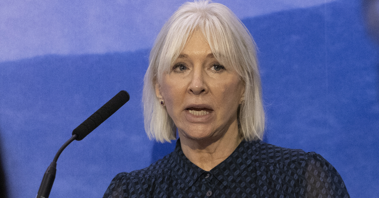 Nadine Dorries speaking at a lectern
