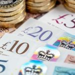An image showing bank notes and pound coins