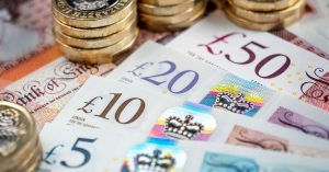An image showing bank notes and pound coins