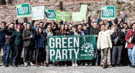 Green Party campaigners holding a Green Party banner in Bristol