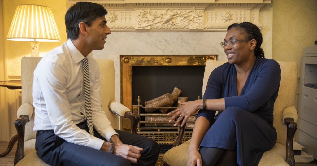 Rishi Sunak sitting with Kemi Badenoch