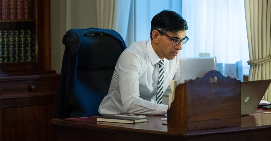 Rishi Sunak looking at a laptop screen