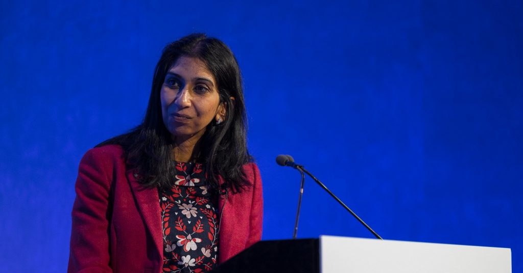 Suella Braverman speaking at a lectern