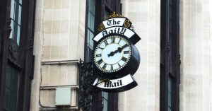 A clock with the words "The Daily Mail"