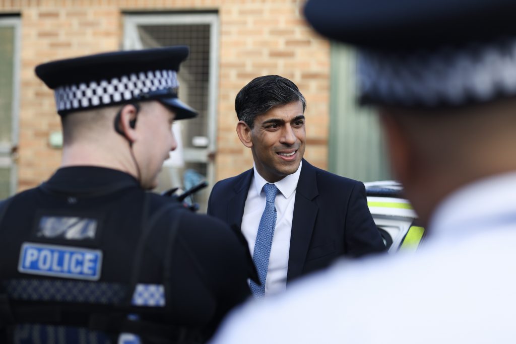 Rishi Sunak with police