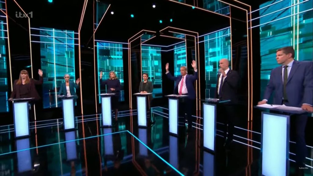 Representatives of British political parties at the ITV debate. Angela Rayner, Penny Mordaun, Daisy Cooper and Nigel Farage have their hands raised. Stephen Flynn, Carla Denyer and Rhun ap Iorwerth do not.