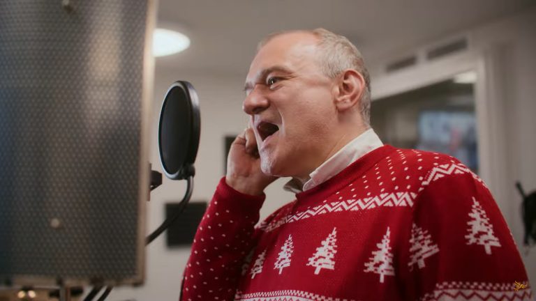 Ed Davey in the video for his charity Christmas single