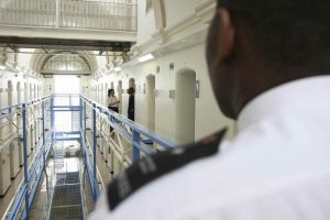 A photo of a prison officer on duty in a prison