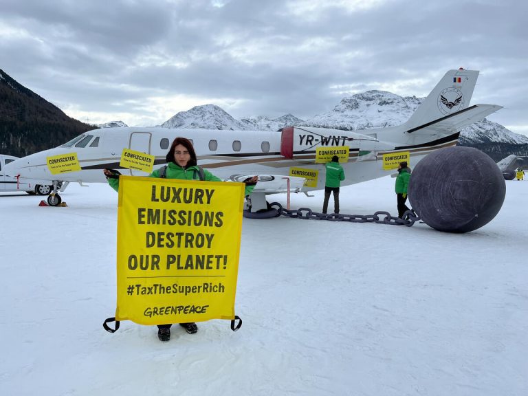 A photo of Greenpeace activists protesting at the World Economic Forum annual summit in Davos, Switzerland