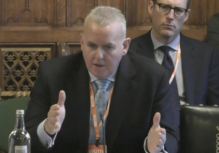 A photo of the CEO of McDonald's Alistair Macrow speaking at the Business and Trade Select Committee