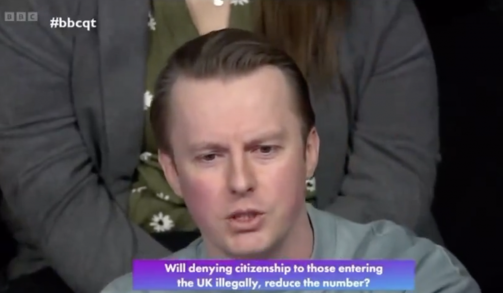 A photo of a BBC Question Time audience member challenging Tory MP Danny Kruger on illegal immigration
