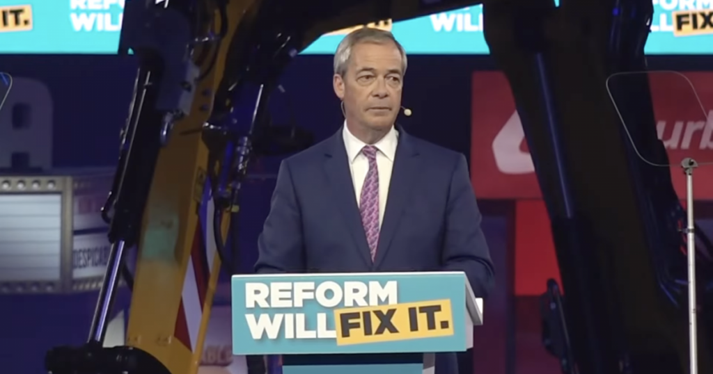 A photo of Nigel Farage at Reform UK's local election campaign rally in Birmingham