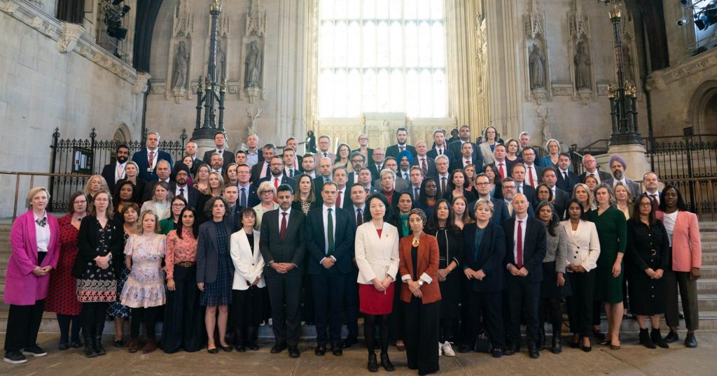 MPs join a photo call in solidarity with two Labour MPs who were barred from entering Israel