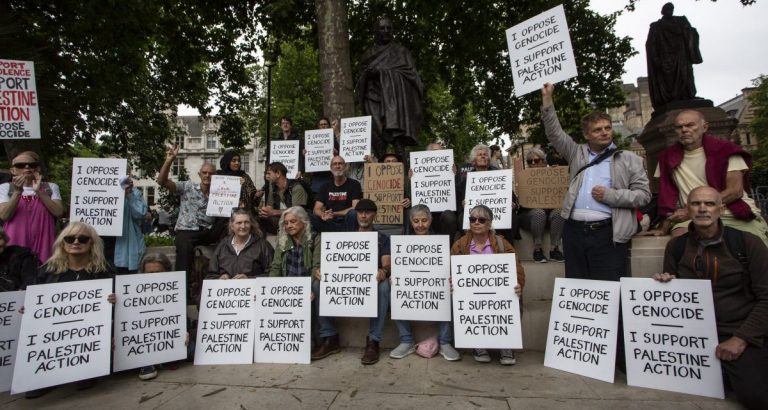 People protesting the banning of Palestine Action in Parliament Square