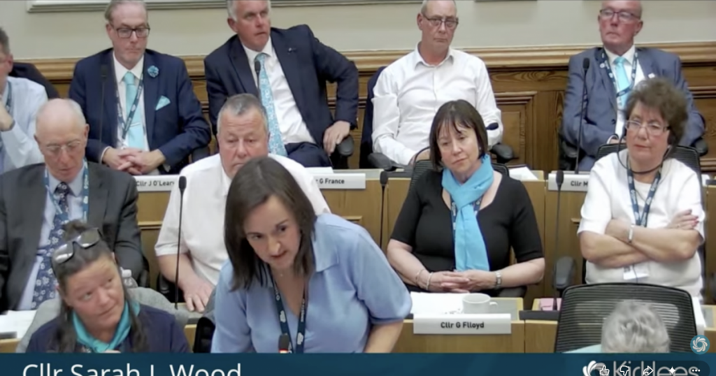 Reform councillors sit in a meeting to elect a council leader