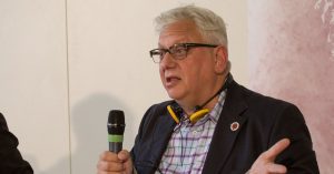 Momentum founder Jon Lansman speaking at a meeting