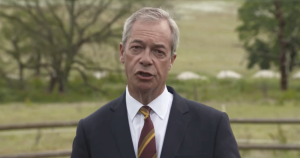 A photo of Nigel Farage making a speech about Henry Nowak's murder