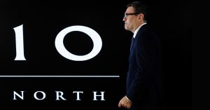 Andy Burnham walking past a Number 10 North sign