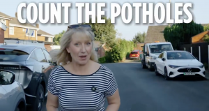 A photo of Sian Astley speaking about JCB pothole machines