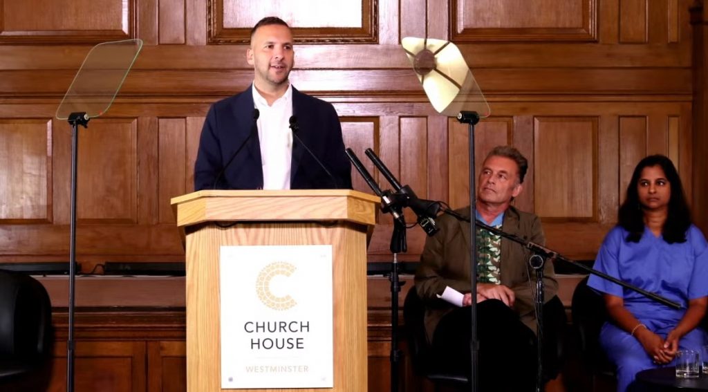 Zack Polanski speaking at a press conference on climate policy
