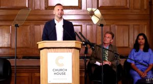 Zack Polanski speaking at a press conference on climate policy