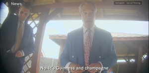 A photo of Nigel Farage talking to an undercover reporter