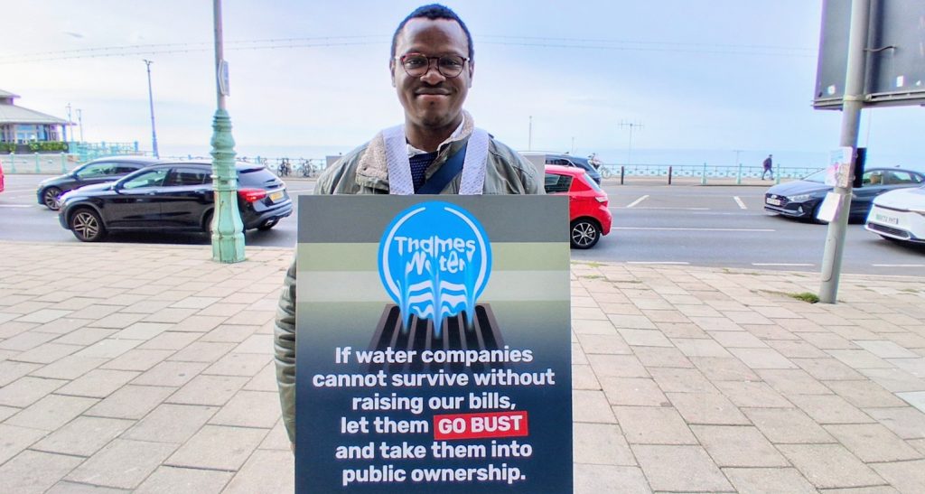 A photo of We Own It campaigner Johnbosco Nwogbo at Green Party conference