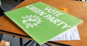 A vote Green placard Party